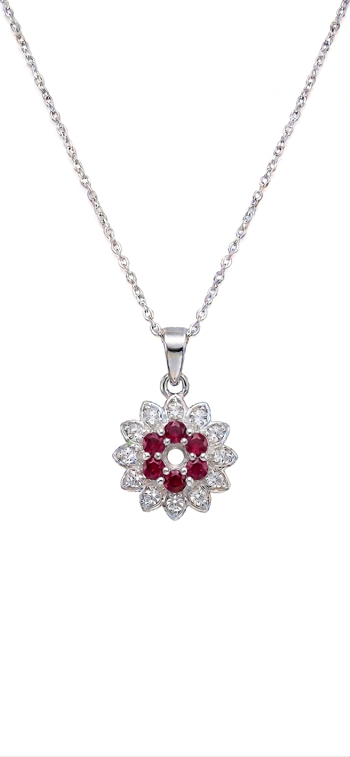 Silver necklace with a floral pendant featuring red stones on a white background