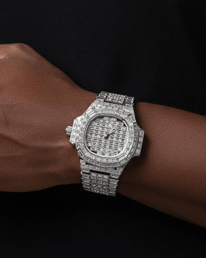 Silver diamond-encrusted watch on a wrist against a black background