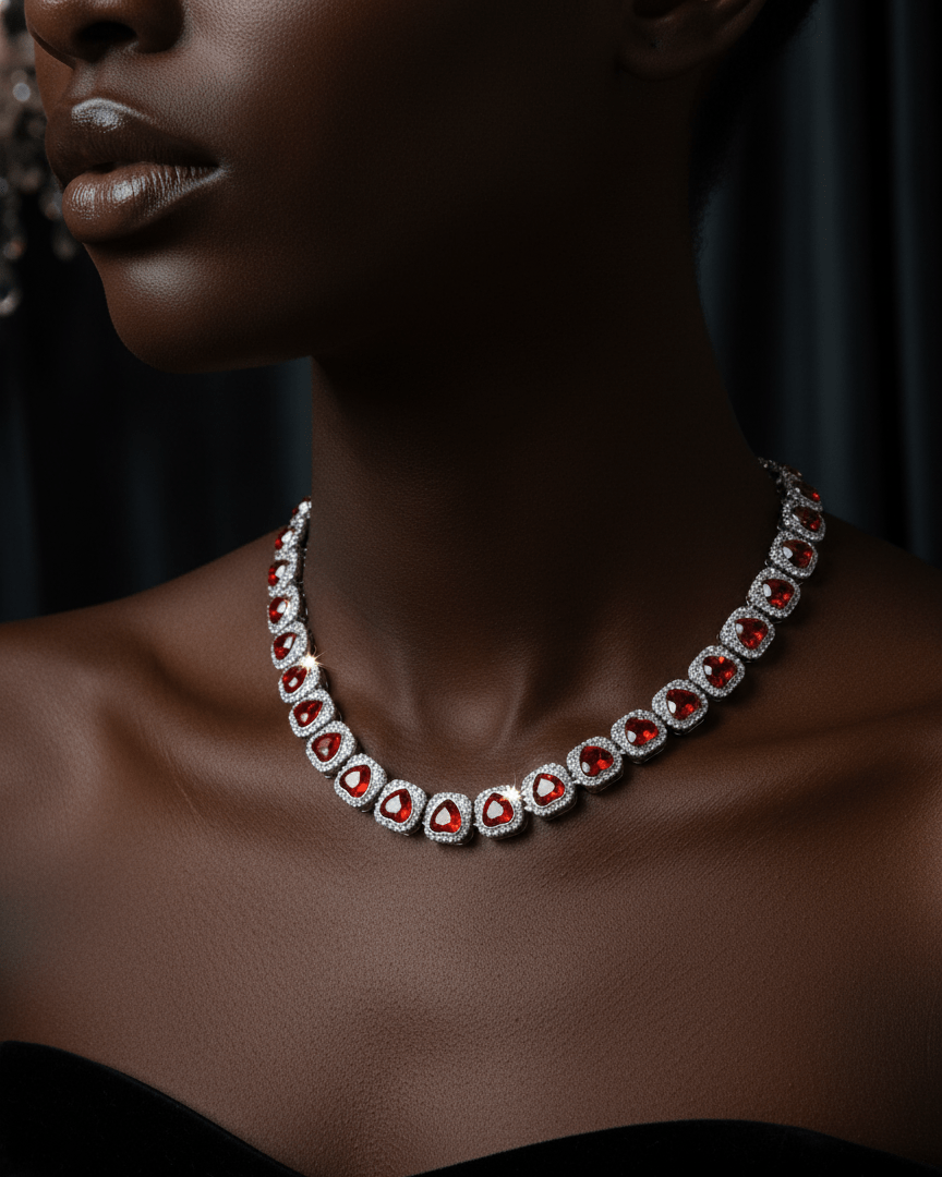 Elegant necklace with red gemstones on a model against a dark background, featuring the Hypenation brand.