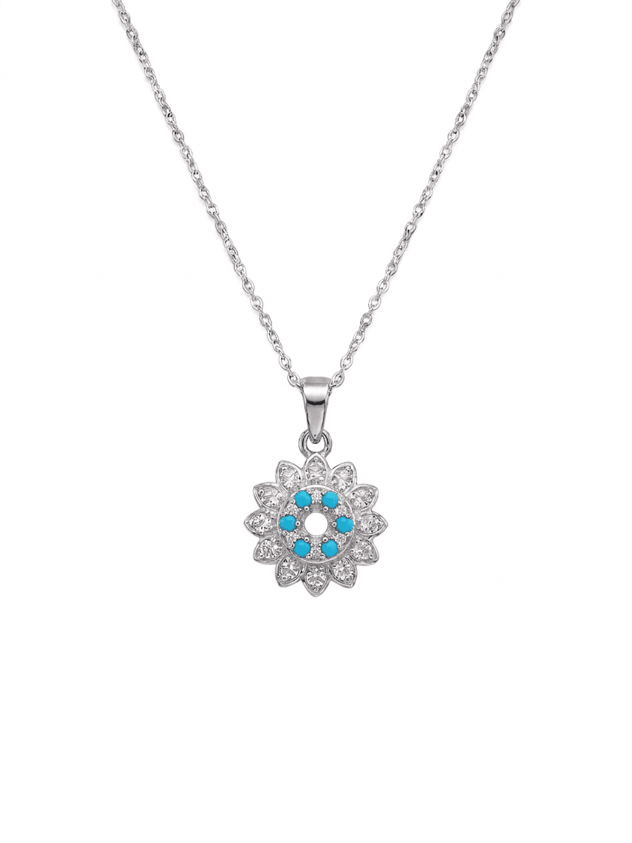 Silver necklace with a flower-shaped pendant featuring blue stones on a white background