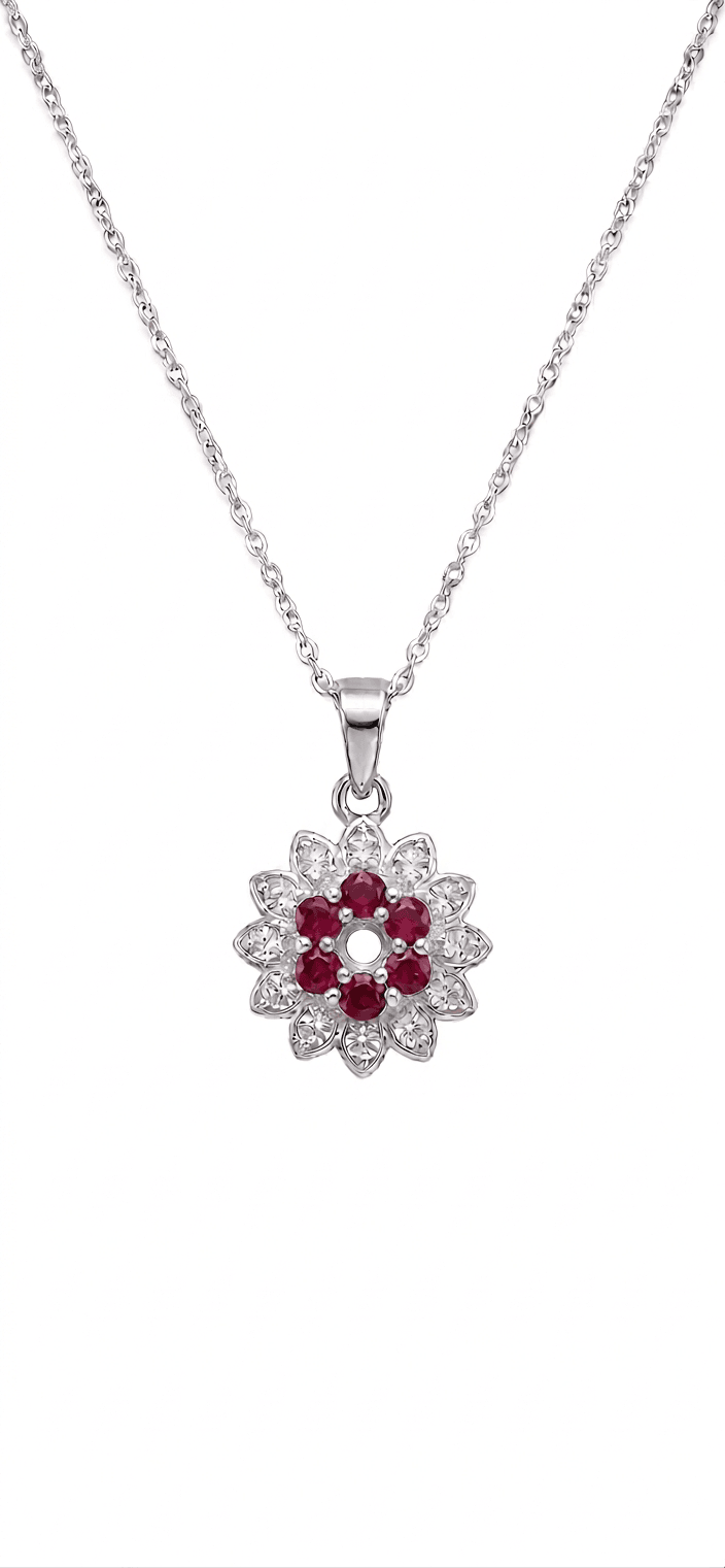 Silver necklace with a floral pendant featuring red stones on a white background