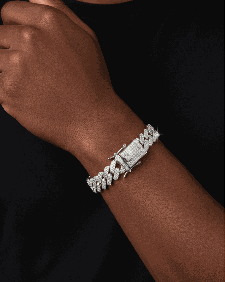 Silver bracelet on a wrist against a black background